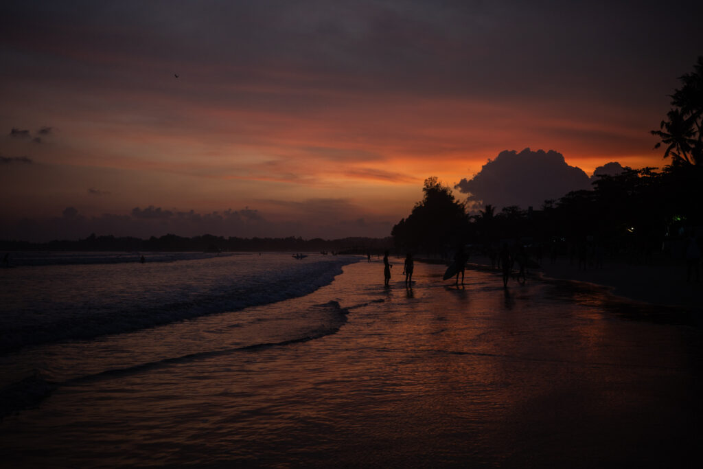 sunset and surfing on the beach in Weligama 